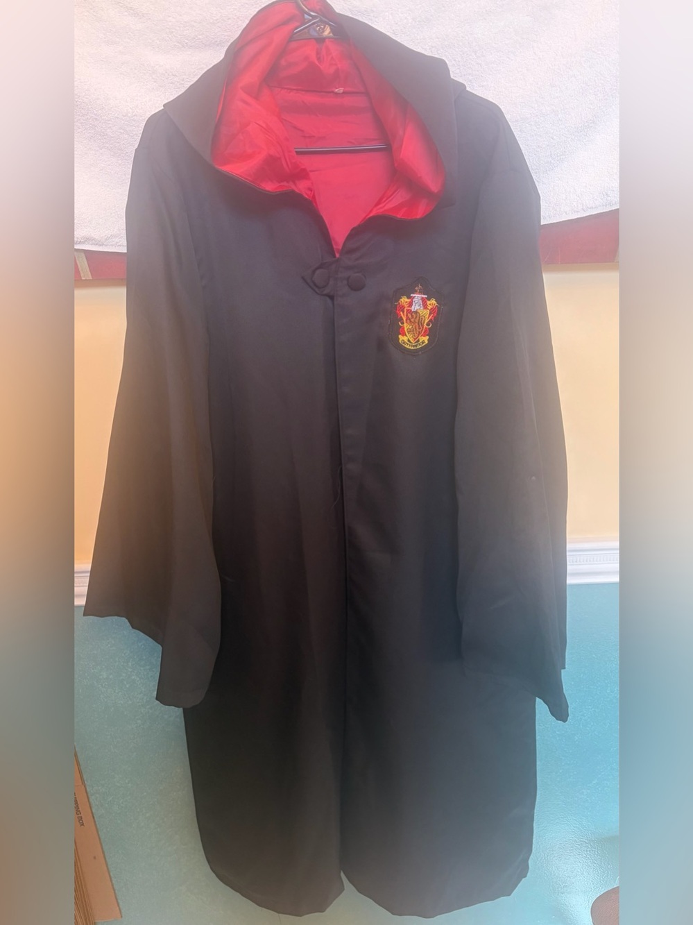 Black Coat with Red Lining and Gryffindor Patch